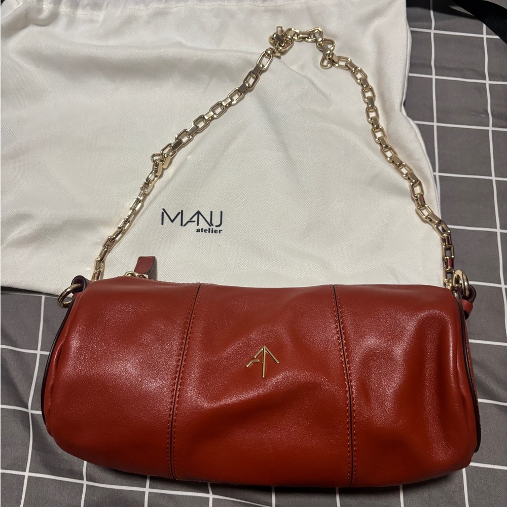 Manu Atelier dark red leather cylinder bag